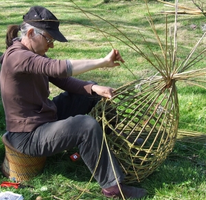 The lobster pot grows, the knot weave spirals around, making sure the gap between each layer is no more than 2 inches. Dont want the lobster escaping.